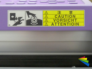 Waarschuwingssticker met pikto op machine